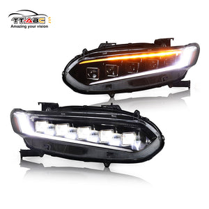 Two car headlights with LED lights on a white background, featuring the TT-ABC brand.